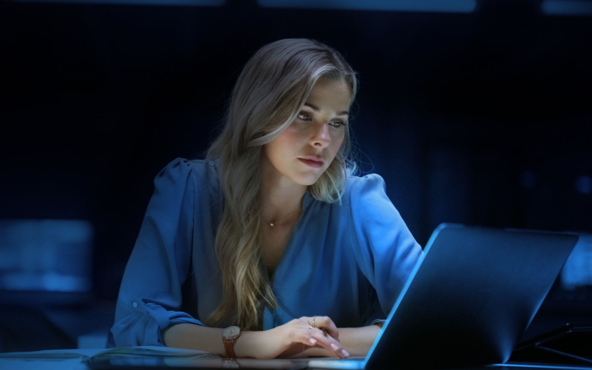 hands typing on a laptop