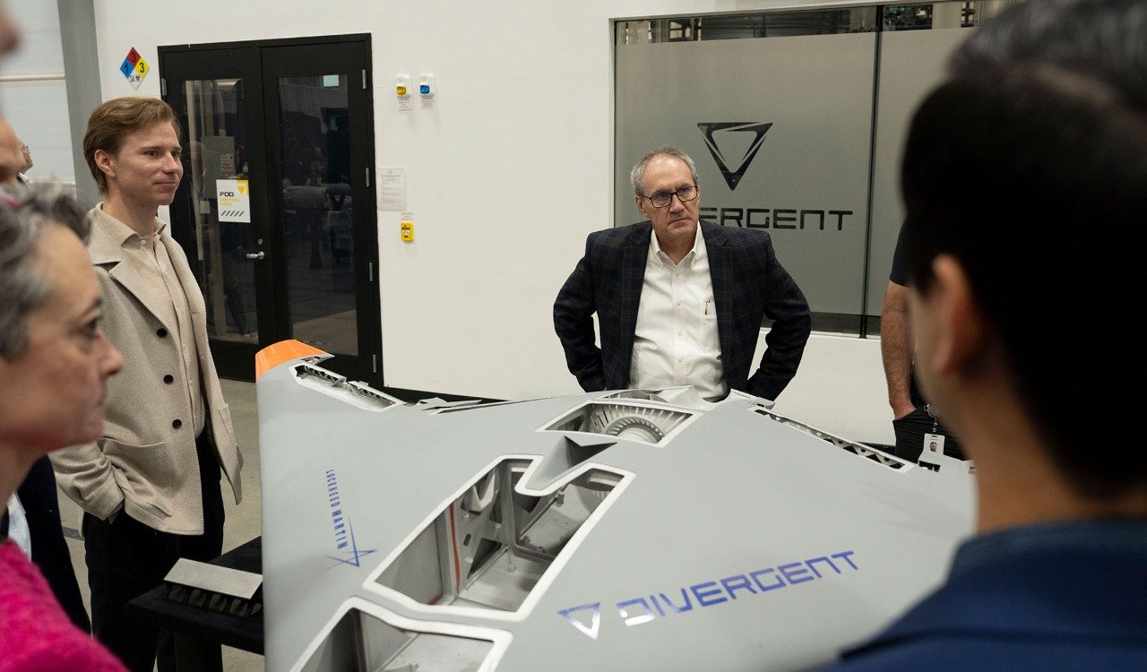 Members of Lockheed Martin’s leadership team discuss the Replicator during a recent visit.