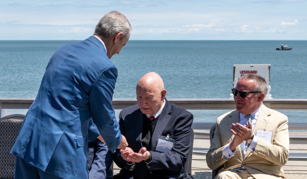 Sikorsky VP & General Manager Rich Benton presents a Sikorsky Rescue Pin to Dimitry Viner’s son, Dr. Nick Viner.
